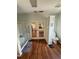 Bathroom featuring a glass-enclosed shower, toilet, and double doors that open into the bedroom at 11312 Brussels Boy Ln, Riverview, FL 33578