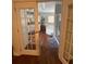 Bathroom with tub and shower unit viewed through open French doors at 11312 Brussels Boy Ln, Riverview, FL 33578