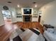 Bright living room with hardwood floors, fireplace, and built-in shelving at 11312 Brussels Boy Ln, Riverview, FL 33578