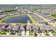 Aerial view of a residential area with a lake, showcasing community layout and surroundings at 11688 Brighton Knoll Loop, Riverview, FL 33579