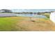 Spacious backyard with a tranquil pond view, offering a peaceful retreat and space for outdoor activities at 11688 Brighton Knoll Loop, Riverview, FL 33579