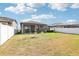 Spacious backyard with a covered patio, perfect for outdoor living and entertaining at 11688 Brighton Knoll Loop, Riverview, FL 33579