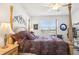 Bright bedroom with a large window, creating a serene atmosphere with comfortable furnishings at 11688 Brighton Knoll Loop, Riverview, FL 33579
