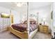 Comfortable bedroom with a four-poster bed, soft lighting, and neutral decor for a relaxing retreat at 11688 Brighton Knoll Loop, Riverview, FL 33579