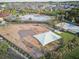 Aerial view of the community playground, basketball court, and swimming pool in a Gathering-friendly neighborhood at 11688 Brighton Knoll Loop, Riverview, FL 33579