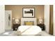 Cozy bedroom showcasing a bed with decorative pillows, bedside tables, and stylish decor at 11845 Sparkling Topaz Cv, Parrish, FL 34219