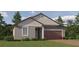 Charming single-story home featuring a welcoming entrance, two-car garage, and well-maintained landscaping at 11845 Sparkling Topaz Cv, Parrish, FL 34219