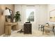 Inviting home office with a wooden desk, stylish chair, and decorative accents for a productive workspace at 11845 Sparkling Topaz Cv, Parrish, FL 34219