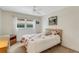 Inviting bedroom features a floral patterned bedspread, natural light, and comfortable sleeping space at 120 Cedarwood Cir # 120, Seminole, FL 33777