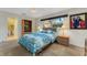 Bright bedroom with natural light, with a view to an ensuite bathroom, and carpeted flooring at 120 Cedarwood Cir # 120, Seminole, FL 33777