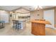 Well-equipped kitchen with modern appliances, center island and breakfast bar at 120 Cedarwood Cir # 120, Seminole, FL 33777
