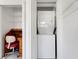 This efficient laundry closet with built in wire shelves, features a stacked washer and dryer unit at 120 Cedarwood Cir # 120, Seminole, FL 33777