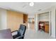Office space features a built-in cabinet, with views to the sunroom and potential for functional desk and working space at 120 Cedarwood Cir # 120, Seminole, FL 33777