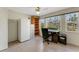 Functional office space with tiled floor, natural light, storage cabinets, and room for a desk setup at 120 Cedarwood Cir # 120, Seminole, FL 33777
