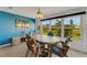 Inviting sunroom featuring tiled floors, ample natural light, and views of the well-maintained outdoor landscape at 120 Cedarwood Cir # 120, Seminole, FL 33777