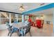 Bright sunroom with ample seating and views, connecting indoor and outdoor spaces seamlessly at 120 Cedarwood Cir # 120, Seminole, FL 33777
