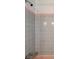 Shower in vintage-style bathroom with gray and pink accent tile at 1242 Nelson St, Dunedin, FL 34698