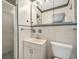 Compact bathroom featuring a vanity with storage, a shower, and a toilet at 1242 Nelson St, Dunedin, FL 34698