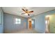 Bedroom with light blue walls, a floral ceiling border, and plush carpet at 1242 Nelson St, Dunedin, FL 34698
