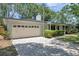 Charming single story home with a 2-car garage and a well-manicured lawn at 1242 Nelson St, Dunedin, FL 34698