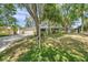 Charming single story home with a 2-car garage and a lush front lawn at 1242 Nelson St, Dunedin, FL 34698