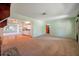Open-concept living room with hardwood and carpet floors, connecting to the kitchen at 1242 Nelson St, Dunedin, FL 34698