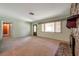 Spacious living room with a large window, a stone fireplace, and an open layout at 1242 Nelson St, Dunedin, FL 34698