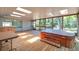 Spacious enclosed patio featuring a wooden hot tub and outdoor bar area at 1242 Nelson St, Dunedin, FL 34698