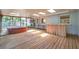 Screened patio with wood flooring, hot tub, and an outdoor bar perfect for entertaining at 1242 Nelson St, Dunedin, FL 34698