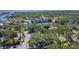 An aerial view of a neighborhood with mature trees and houses near the coast at 1247 21St St, Sarasota, FL 34234