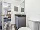 This bathroom features modern gray cabinets and a granite countertop at 1247 21St St, Sarasota, FL 34234