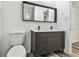 Stylish bathroom features a double sink vanity, sleek fixtures, and a large modern mirror at 1247 21St St, Sarasota, FL 34234