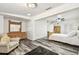Spacious bedroom with chair, dresser and mirror and ceiling fan at 1247 21St St, Sarasota, FL 34234
