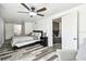 Comfortable bedroom featuring natural light, modern ceiling fan, and decor at 1247 21St St, Sarasota, FL 34234