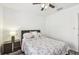 Comfortable bedroom with a ceiling fan and an end table at 1247 21St St, Sarasota, FL 34234