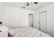 Bedroom with light floral bedding, wood-look flooring and plenty of natural light at 1247 21St St, Sarasota, FL 34234