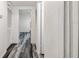 Clean hallway features wood-look flooring, and access to multiple rooms and closets at 1247 21St St, Sarasota, FL 34234