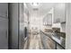 Modern kitchen featuring stainless steel appliances, granite countertops, and sleek grey cabinetry at 1247 21St St, Sarasota, FL 34234