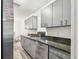 Modern kitchen featuring gray cabinets, granite countertops, and stainless steel appliances at 1247 21St St, Sarasota, FL 34234
