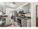 Modern kitchen featuring stainless steel appliances, granite countertops, and sleek grey cabinetry at 1247 21St St, Sarasota, FL 34234