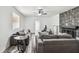 Spacious living room with contemporary furniture, a ceiling fan, and a decorative fireplace at 1247 21St St, Sarasota, FL 34234