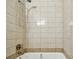 A standard sized tub with tiled walls and shower head at 1247 21St St, Sarasota, FL 34234