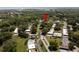 Aerial view of a residential community with mature trees and a community pool at 1278 Mission Cir # 45B, Clearwater, FL 33759