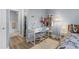 Bedroom with desk area, neutral paint, and wood-look floors at 1278 Mission Cir # 45B, Clearwater, FL 33759