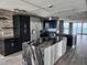 Open concept kitchen with a waterfall island, stainless steel appliances, and contemporary design at 1290 Gulf Blvd # 1701, Clearwater Beach, FL 33767