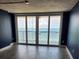 Living room features sliding glass doors and an ocean view at 1290 Gulf Blvd # 1701, Clearwater Beach, FL 33767