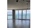 Expansive ocean view seen through floor to ceiling windows, with sliding glass doors to a large terrace at 1290 Gulf Blvd # 1701, Clearwater Beach, FL 33767