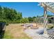 Spacious backyard featuring a fire pit area, landscaping, and plenty of room for outdoor enjoyment at 12935 Solola Way, Trinity, FL 34655