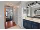 Bathroom entrance from the main bedroom with double vanity and tile flooring at 12935 Solola Way, Trinity, FL 34655