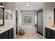 Ensuite bathroom with a large soaking tub, glass shower and double vanity at 12935 Solola Way, Trinity, FL 34655
